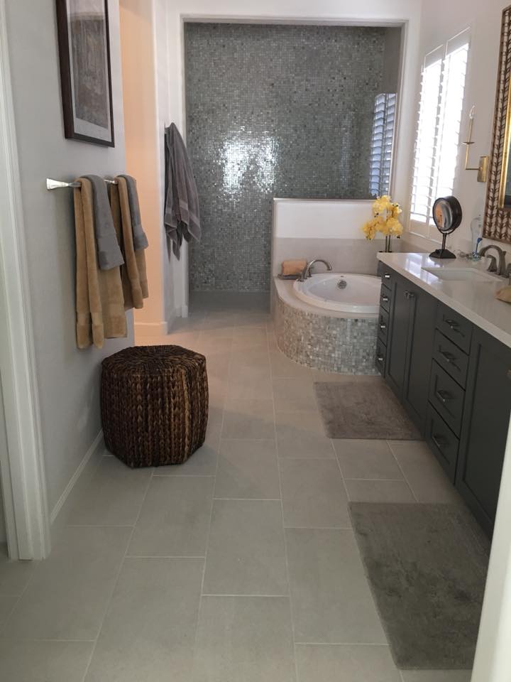 Full master bathroom remodel with tiled floors and custom shower